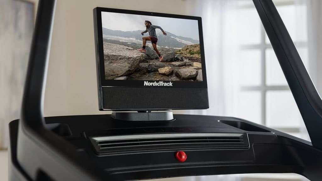 Close-up of a NordicTrack treadmill touchscreen displaying an iFIT outdoor training session.