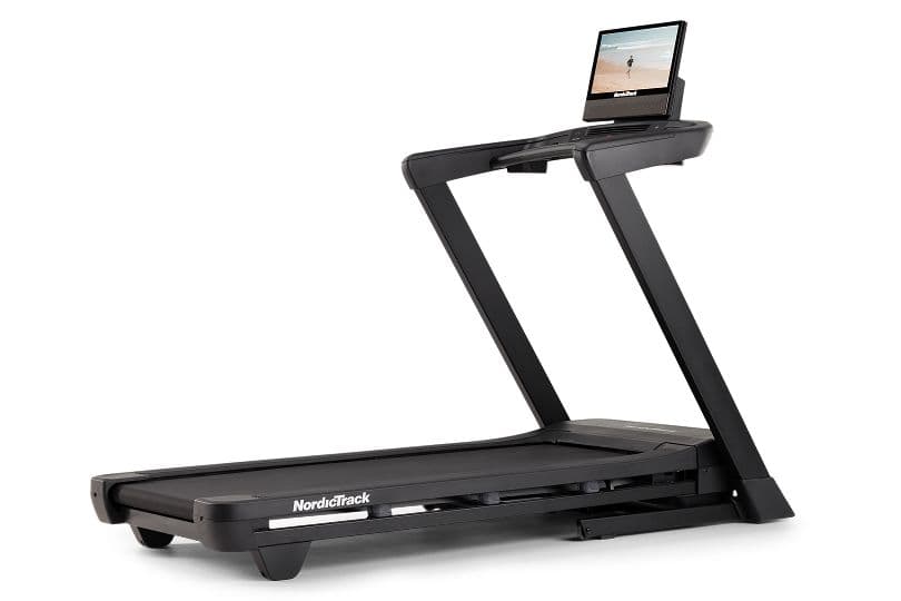 NordicTrack T Series 16 Treadmill with a folded deck and tilting touchscreen, wrapped with a gold bow.