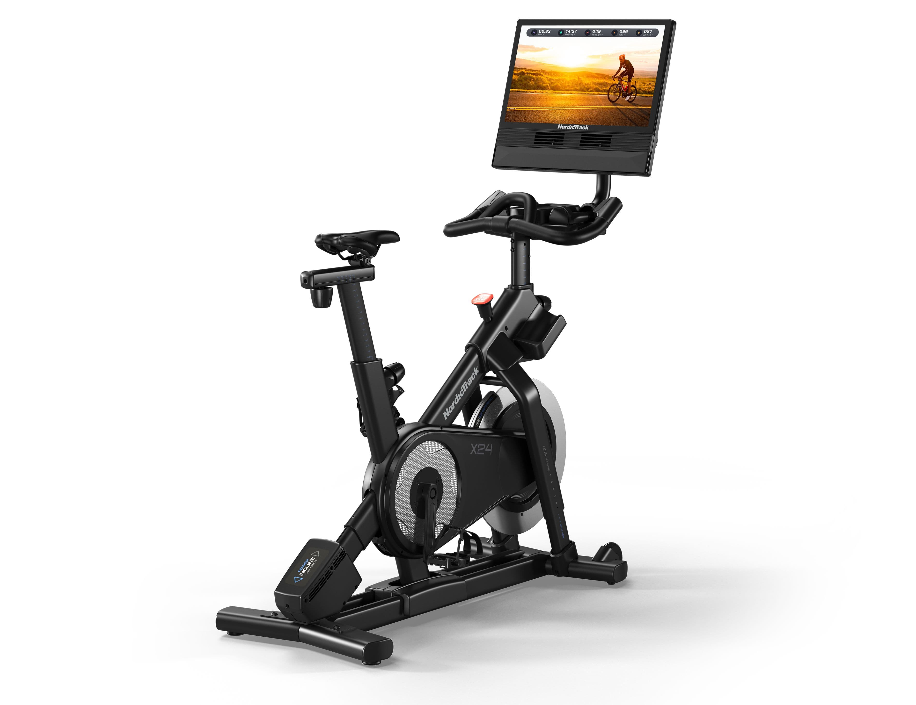 NordicTrack X24 Bike with incline capability and touchscreen, wrapped with a gold bow.