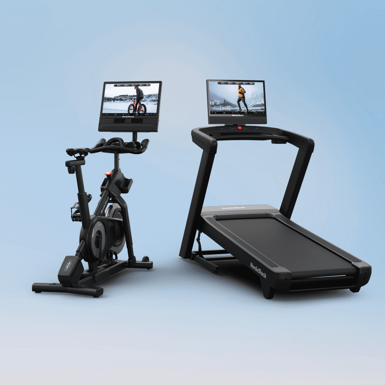 The Commercial 2450 Treadmill sitting side by side the X24 Studio Bike on a blue backdrop, featuring winter workouts on their touchscreens.