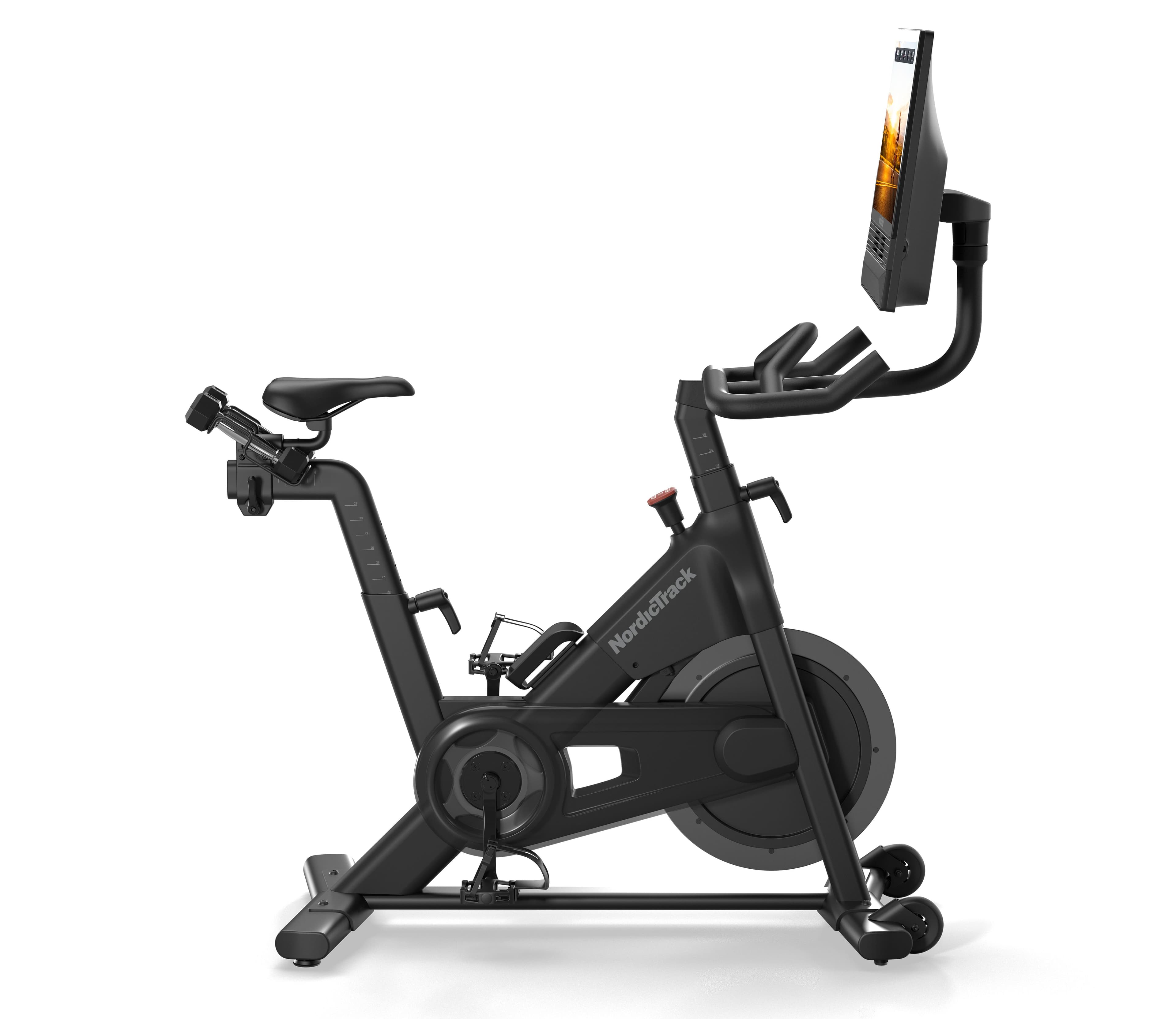 NordicTrack S24 Studio Bike with a pivoting touchscreen, wrapped with a gold bow.