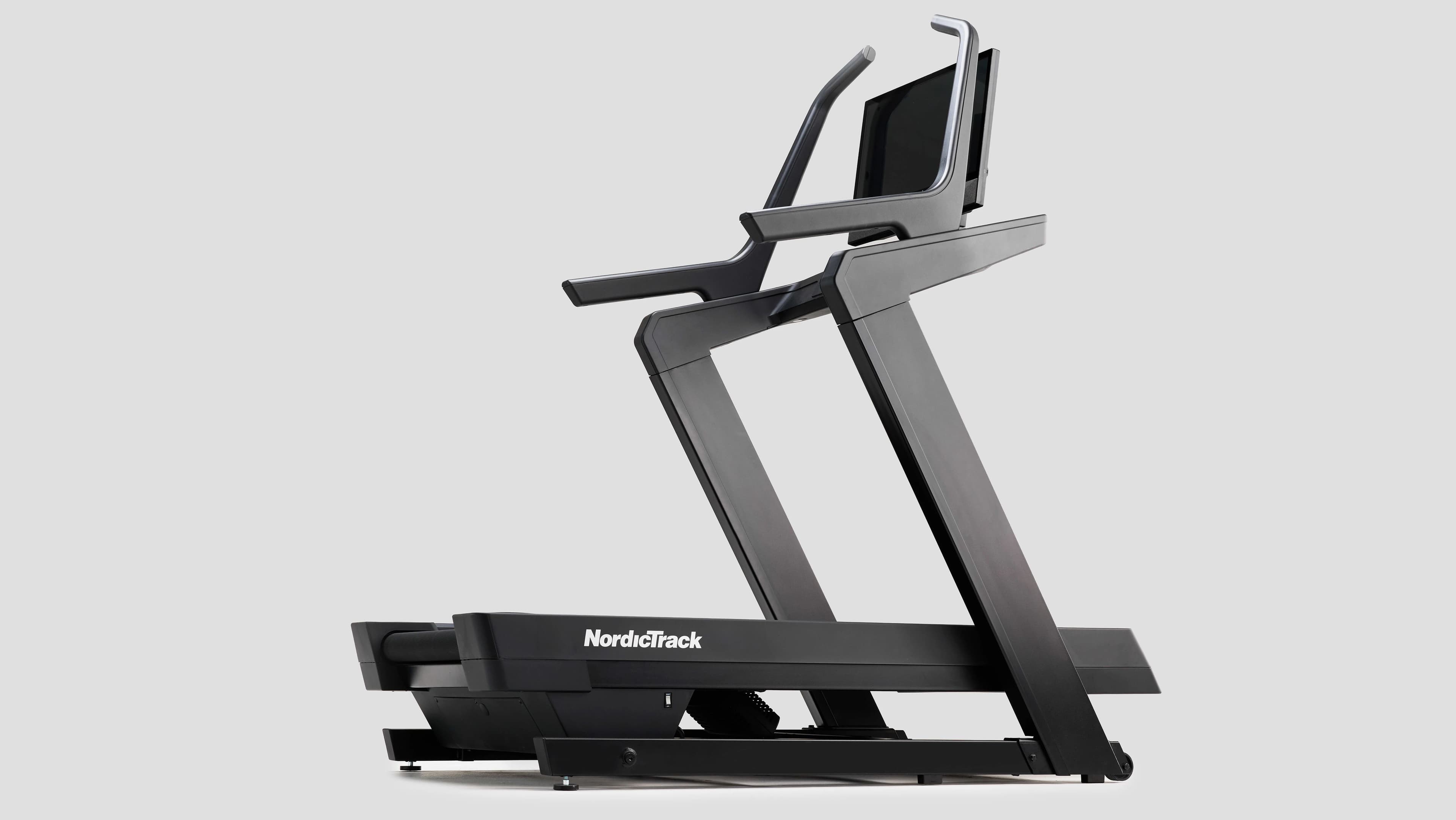 NordicTrack X24 Incline Treadmill with a pivoting touchscreen, wrapped with a gold bow.