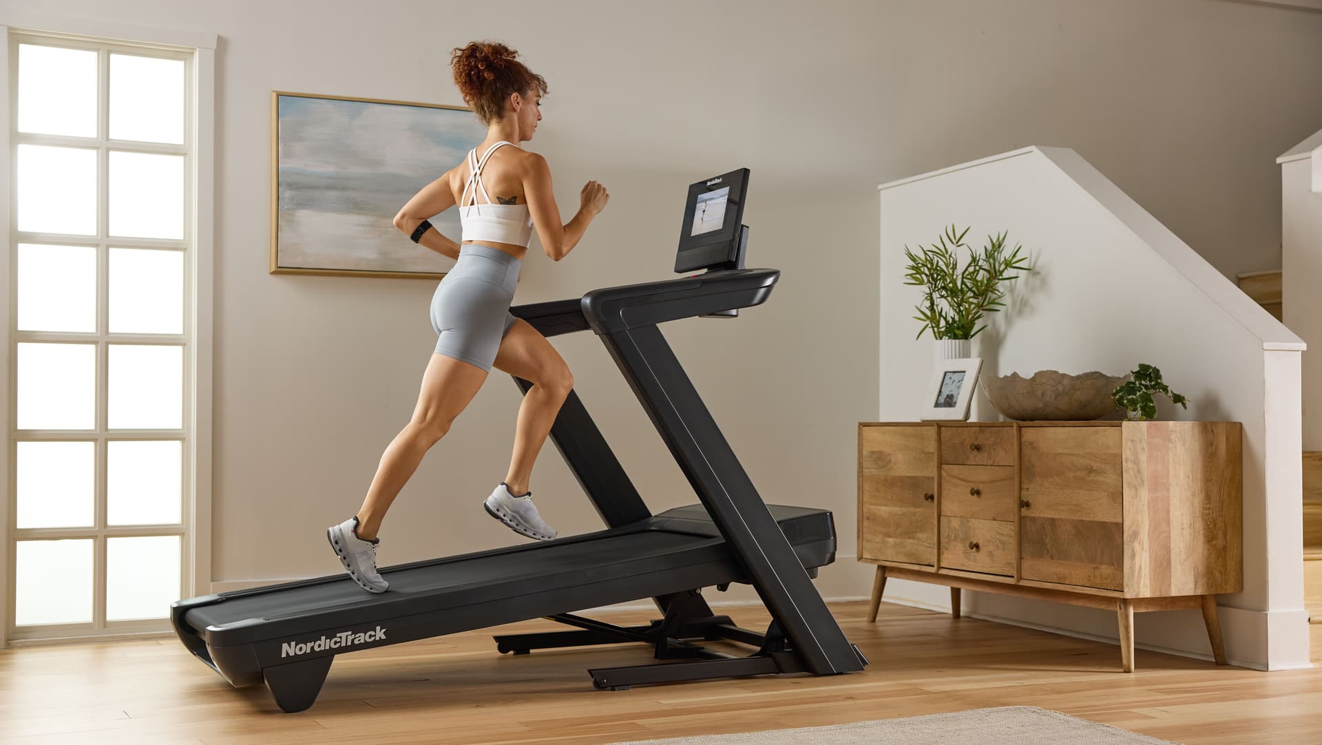 Best NordicTrack treadmill for apartments with foldable design in a modern home setup
