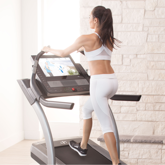 Woman Using a High Incline NordicTrack Treadmill for Walking and Staying Healthy