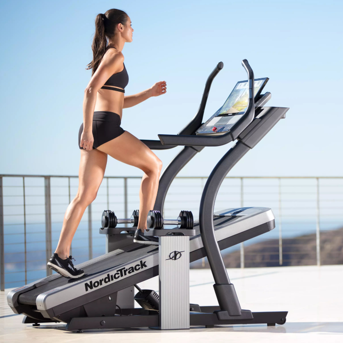 Woman Using a High Incline NordicTrack Treadmill to Walk and Workout