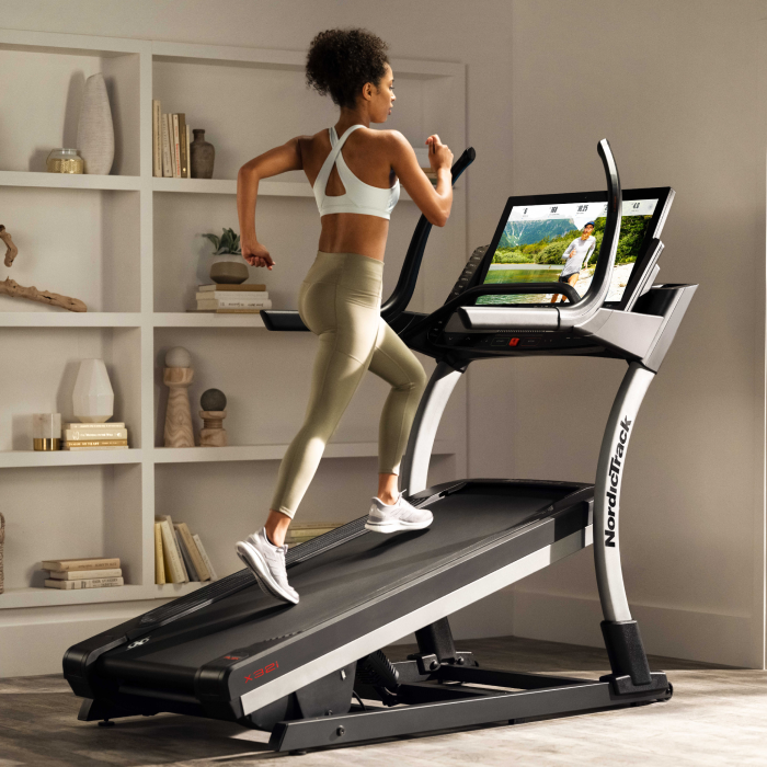 Woman Using High Incline Treadmill from NordicTrack to Workout