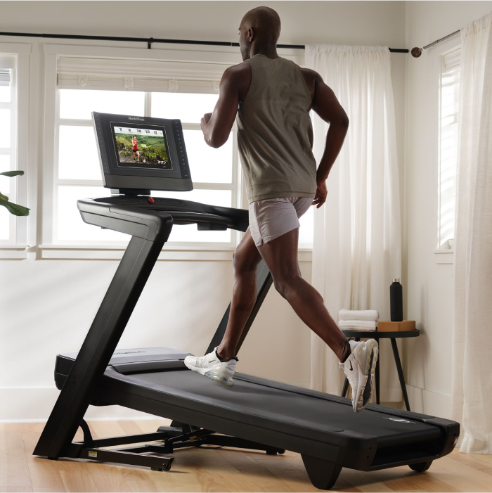 Man Using NordicTrack Treadmill to Vary His Speed and Incline to Reach His Health Goals