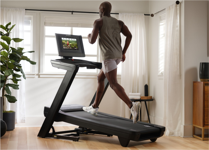 Man Running on His NordicTrack Treadmill to Stay Fit During the Summer Months