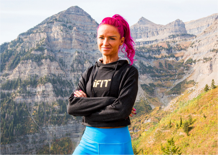 iFIT Trainer Ashley Paulson Poses in Front of an Impressive Mountainview