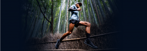 iFIT Trainer Tommy Rivs Running Through a Forest as the Featured Image for the Article How to Start Running Right