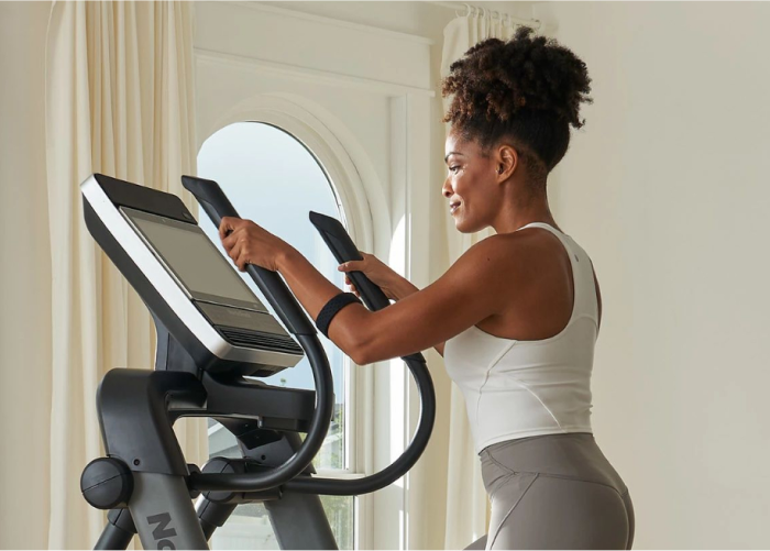Mom Using a NordicTrack Elliptical to Stay on Track with Her Fitness Goals During Back-to-School Time