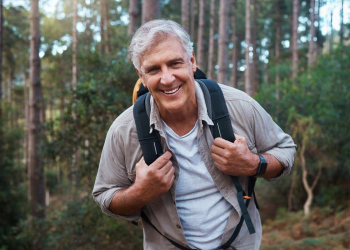 Older Man Hiking Outdoors and Enjoying Nature