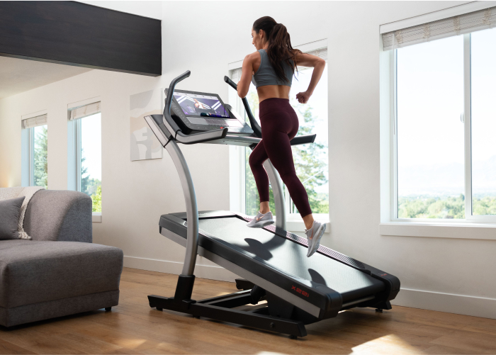 Woman Training on a NordicTrack High Incline Trainer