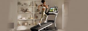 Woman Running on Her NordicTrack for the Article How to Decide on the Best Incline Treadmill