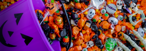 Bowl of Halloween Candy Dumped Out for the Article How to Enjoy Halloween Candy and Still Reach Your Health Goals