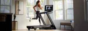 A Woman Running on a Treadmill for the Article: What’s the difference between the NordicTrack Treadmill Models?
