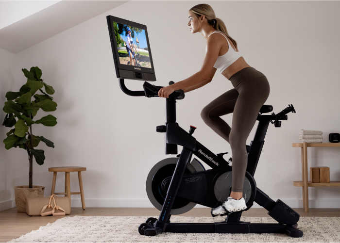 Woman Using a NordicTrack Studio-Style Exercise Bike