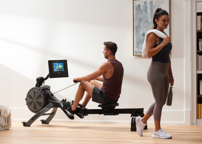 Couple Exercising with a Rowing Machine