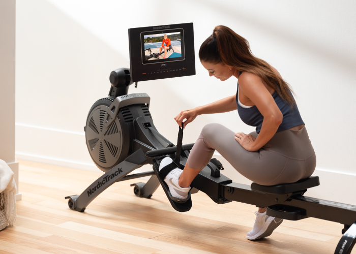 Woman Using Rower to Get in Shape