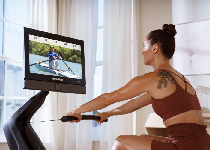 Woman Engaging in an iFIT Rowing Workout