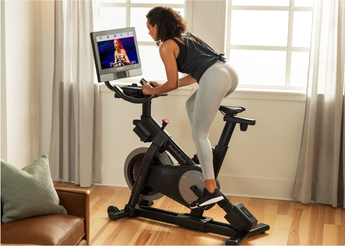 Woman Riding NordicTrack Stationary Exercise Bike