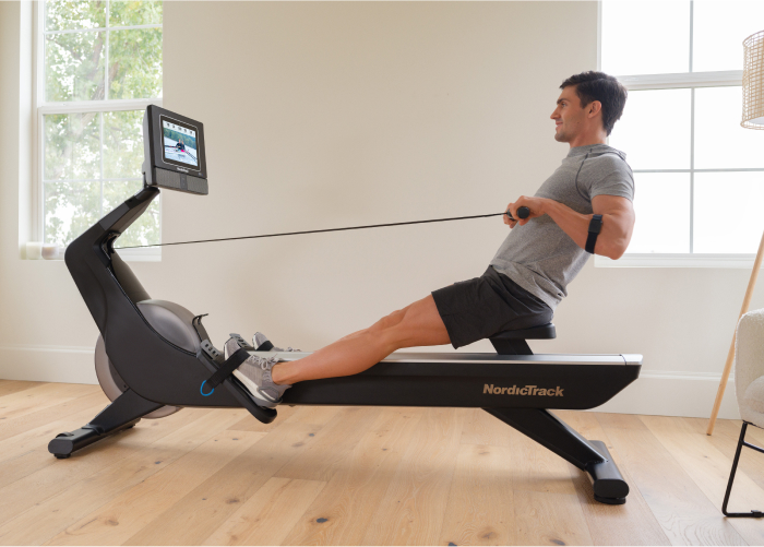 Man Rowing on a NordicTrack Rower and Showing the Health Benefits of Rowing